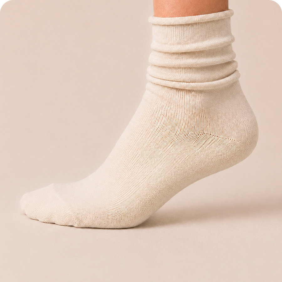 Cream slouch sock worn scrunched down, side view